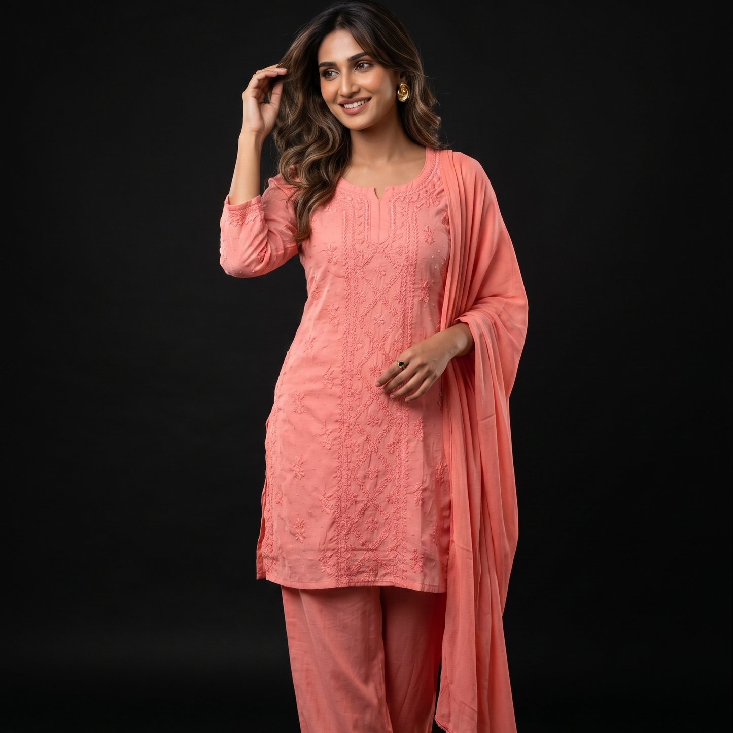 Woman wearing a pink traditional outfit on a black background